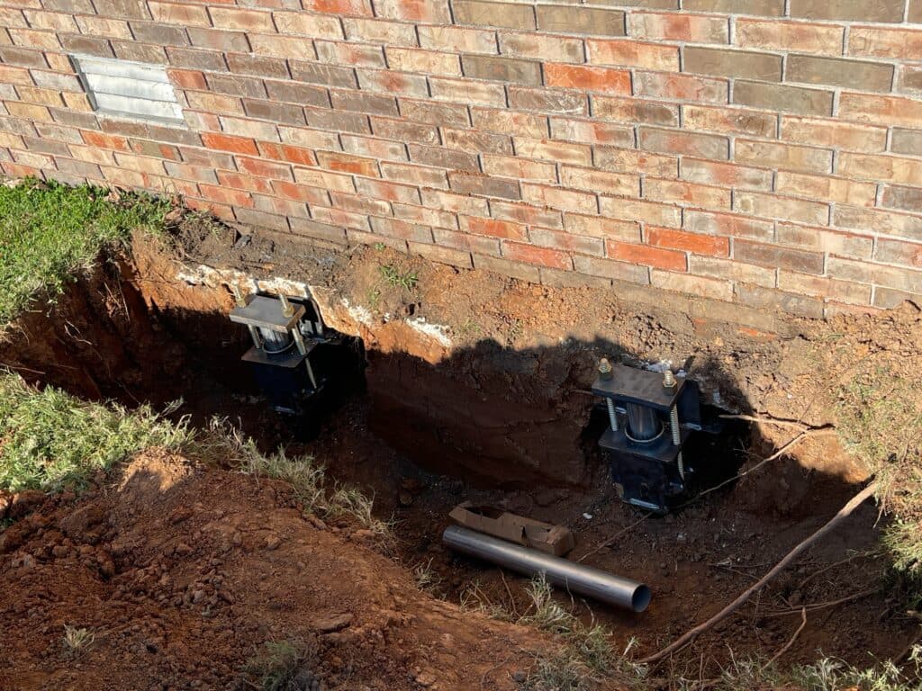 Helical Pier Installation — Brick Foundation Settlement — photo 2
