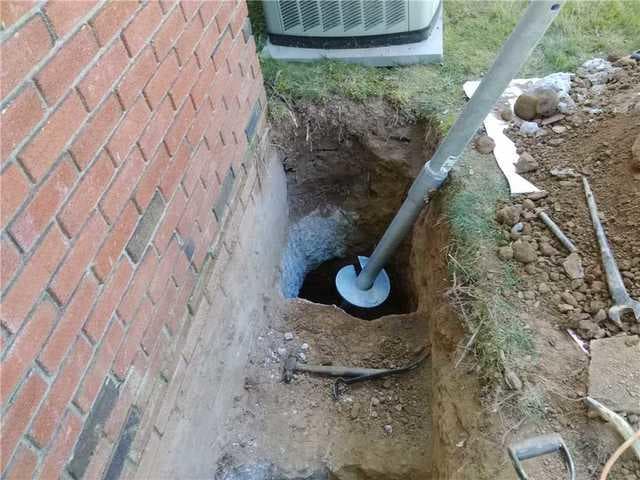 Helical Pier Installation — Brick Foundation Settlement — photo 1